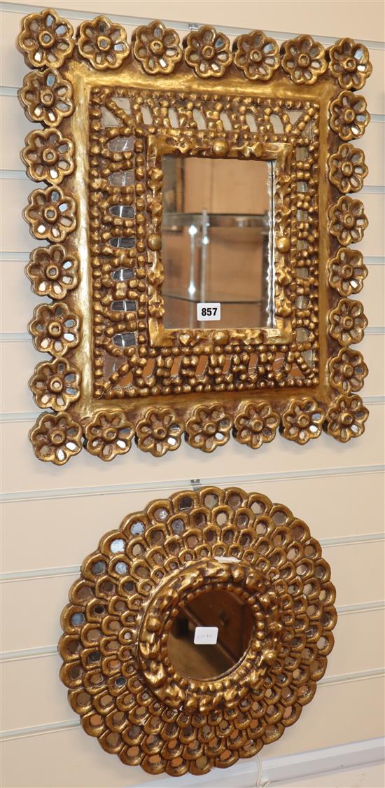 An ornate gilt cushion frame wall mirror and another Larger H.55cm